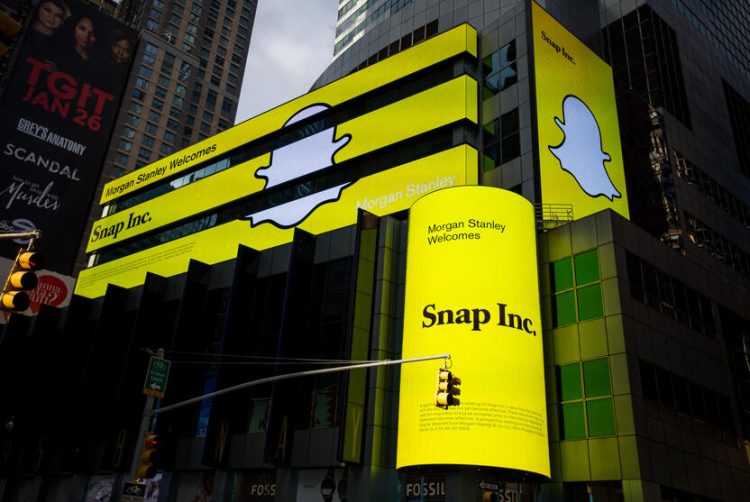 Snap Inc. signage is displayed on screens outside of the Morgan Stanley building in New York, U.S., on Thursday, Feb. 16, 2017. Snap Inc. is seeking to raise as much as $3.2 billion in its initial public offering in what could be the third-biggest technology listing of the past decade. Photographer: Michael Nagle/Bloomberg via Getty Images
